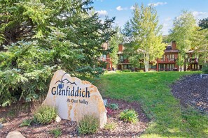 A large stone sign with the name 'Glenfiddich' and 'At Deer Valley' indicating the location. - Private Hot Tub | Walk to the Resort (Park City)
