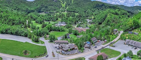 Summer views of Sugar Mountain showcase the golf course, tennis courts, ski slopes, and nearby condos all surrounded by beautiful Blue Ridge scenery.