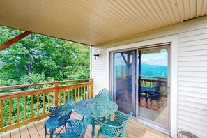 Sip your morning coffee at this charming outdoor seating area, surrounded by lush greenery and sweeping mountain vistas. - Oversized 2 Bedroom Condo with Amazing Views from Two Balconies! (Sugar Mountain)