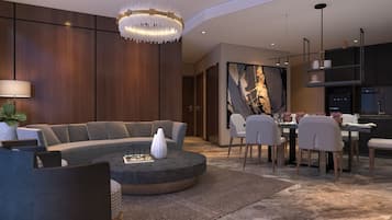 A modern living room with a sectional sofa, a round coffee table, and a dining area with a table and chairs.