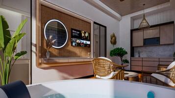A modern bathroom with a bathtub, a mirror, and a wall-mounted TV.