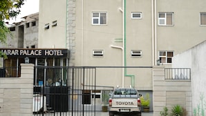 A gated entrance to a hotel with a sign reading 'LARAR PALACE HOTEL'. - Harar Palace Hotel (Harar)