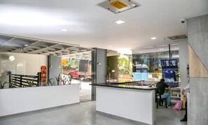 A modern interior with glass partitions, a control panel, and a view of the outside. - "Modern Apartment in Sabaneta with a Panoramic View" (Sabaneta)