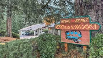 A wooden sign with a map and the name 'ClearHills' indicating a location.