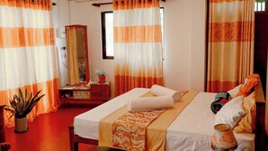 A hotel room with a bed, a bedside table, a mirror, and curtains. - Nature Beat Villa – Exclusive Tropical Retreat Near Mirissa (kamburugamuwa)