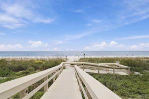 A wooden boardwalk leading to a beach with a clear sky. - Beachfront Condo on Marco Island. Resort style amenities..3 bed, two full bath! (Marco Island)
