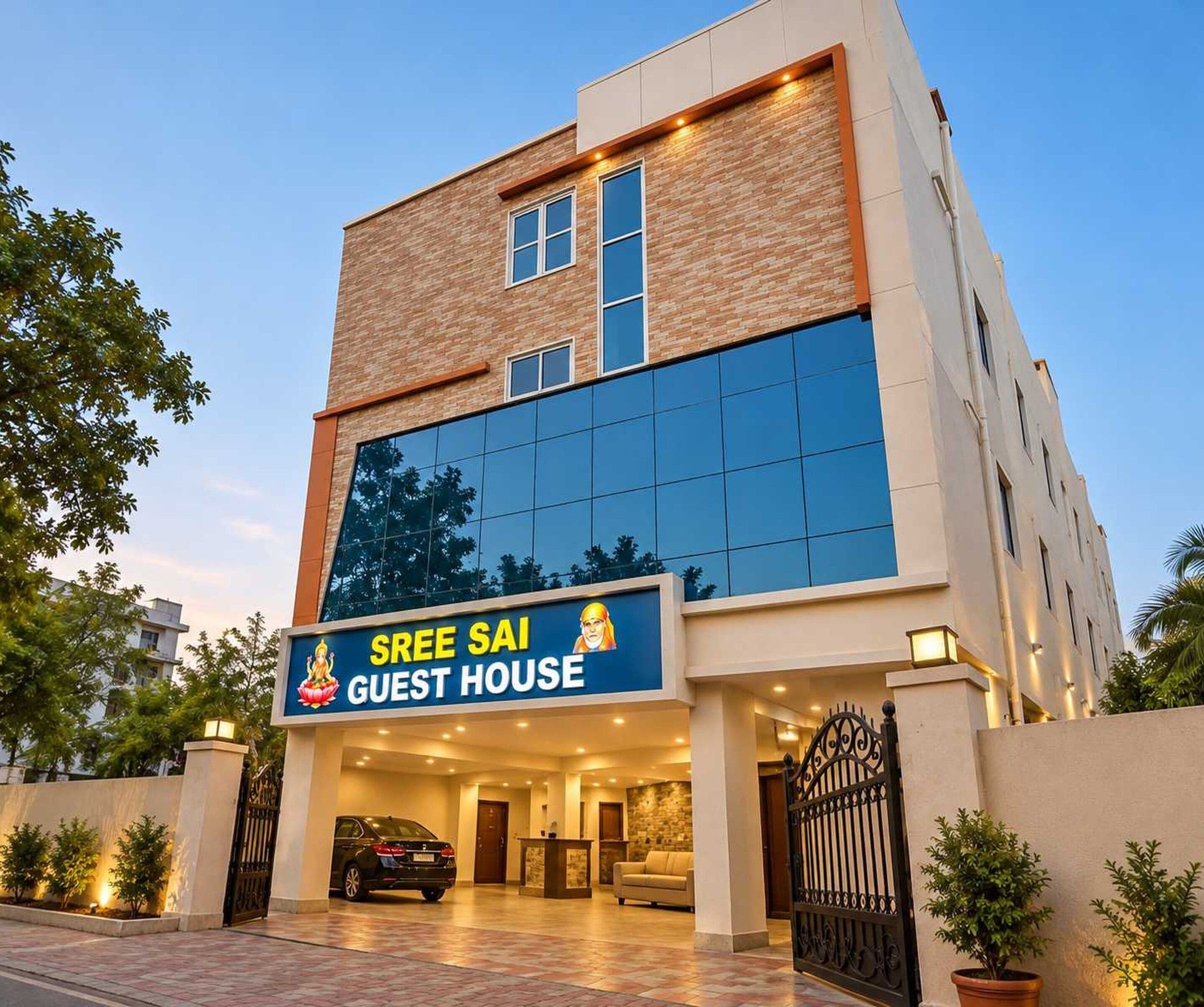 A building with a sign reading 'SREE SAI GUEST HOUSE' and a car parked in front.