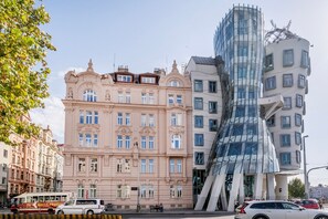 A building with classical architecture and a modern glass structure. - Blueground | New Town, view, nr Vltava River (PRG-125) (Prague)