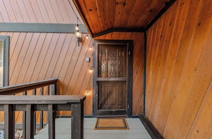 A wooden exterior with a dark door and a small porch area. - Lakewood Escape - 3BR Retreat (South Lake Tahoe)