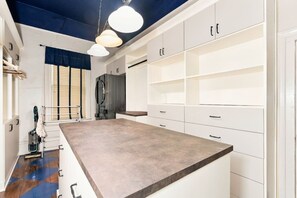 A kitchen with white cabinets, a brown countertop, and pendant lighting. - Vintage Charm, Backyard, WiFi, Near Dtwn Decatur (Decatur)