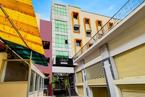 A multi-story building with a storefront at the ground level. - Collection Isckon Formerly Sri Varaahi (Hyderabad)