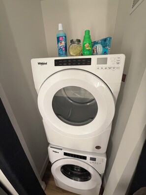 A Whirlpool washing machine with a control panel and a front-loading door. - The Royal Suite luxury apartment Downtown Atlanta Views (Atlanta)