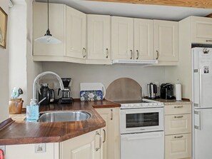 A compact kitchen with a sink, stove, and refrigerator. - "Lutz" - 275m from the sea by Interhome (Faaborg)