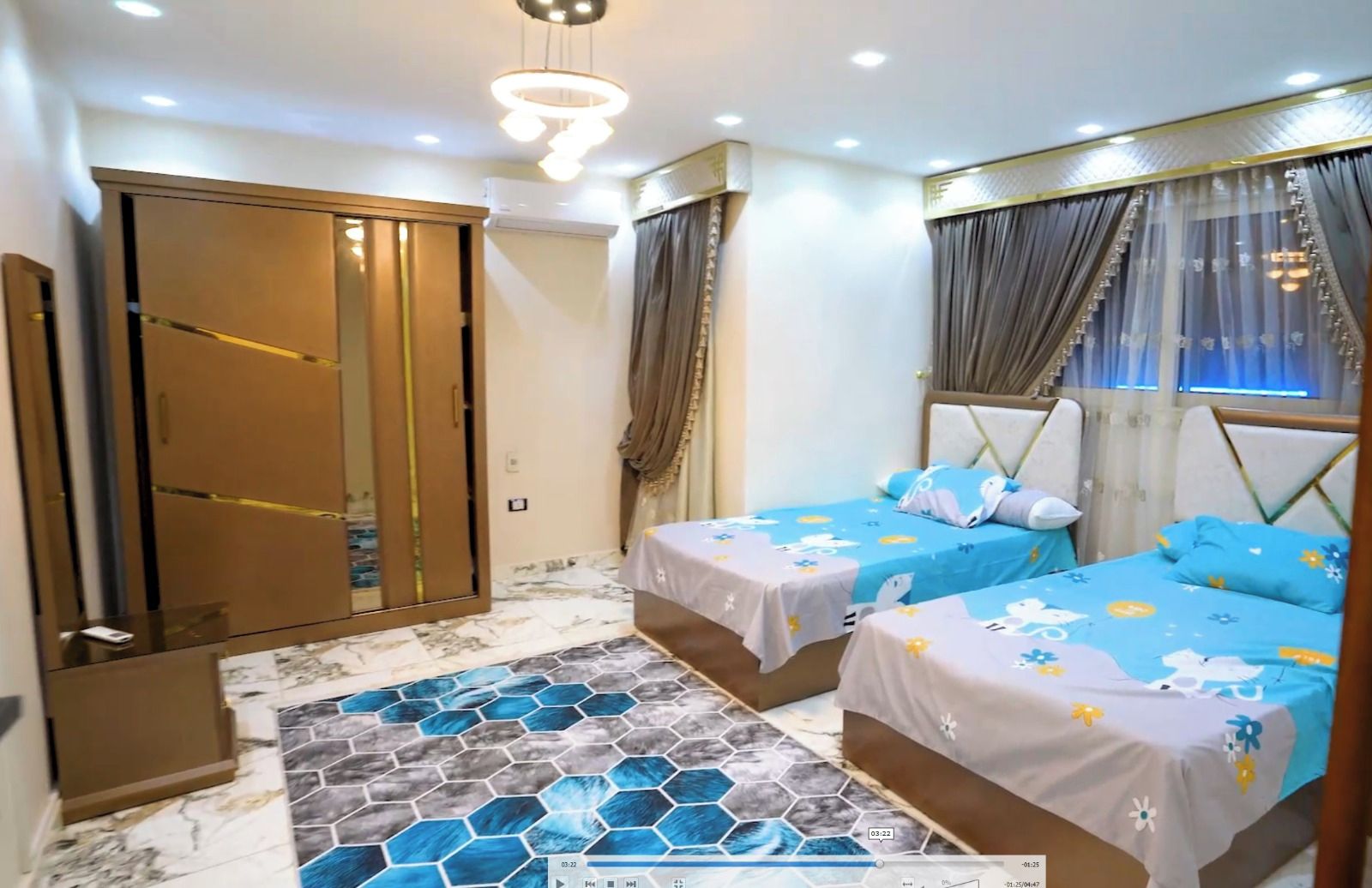 A bedroom with two beds, a wardrobe, and a patterned floor.