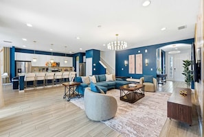 Bright, open-concept living space designed for relaxing together! - Grand Villa w Pool, Spa, Games & Theatre near Disney (Davenport)