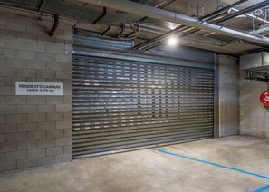 A garage door with a sign indicating resident's car park units 2 to 20. - Unbeatable Convenience, the City on your Doorstep (Fortitude Valley)