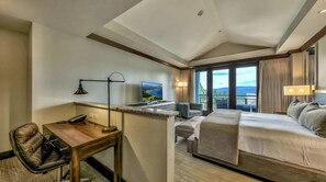 A hotel room with a bed, a desk, a chair, a TV, and a large window with a view. - Northstar Resort, Mid Mountain, Ski in/Ski Out 4- bedroom Penthouse (Truckee)