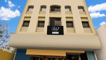 A building with a sign that reads 'Collection Company Serviced'.