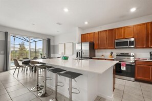Ample kitchen storage and generous counter space for easy meal prep - Designer Home with Private Pool and Disney Access (Kissimmee)