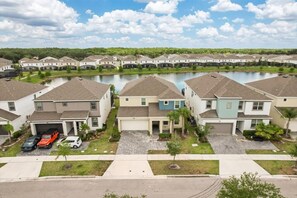 Aerial perspective showing the lush setting and private resort enclave - Designer Home with Private Pool and Disney Access (Kissimmee)