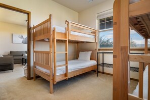 A bunk bed with a view of the outdoors through a window. - Downtown WP Chalet 380 I Private Hot Tub I Great Views I Bunk Room I Discounted Attractions (Fraser)