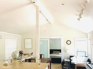 A compact living space with a dining area, a kitchenette, and a bedroom. - Scandinavian Japanese Inspired Modern Sunny Private Home Nestled in Nature (Santa Cruz)