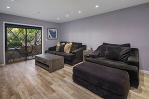 A modern living room with a sofa set, a coffee table, and a side table. - Old Town Scottsdale Oasis&Heated Pools&Golf&Gym (Scottsdale)