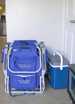 A medical wheelchair with a blue cover and a storage bin beside it. - Private HotTub Escape:ModernLuxe Townhome 2BR3BA (Noord)