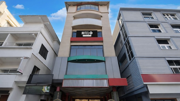 A hotel with a modern facade, a prominent entrance, and a sign reading "HOTELO". - Hotel O Cooch Behar (Cooch Behar)