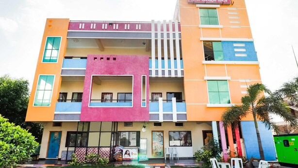A multi-story building with a flat roof, multiple balconies, and a variety of window styles. - Townhouse CMR Complex Poddatur (Proddatur)