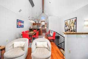 A modern interior with a dining area, kitchen, and living space. - New! Ski Days + Sunset Après | 3BR Mountain Retreat | Walk to Ski + Garage (Telluride)