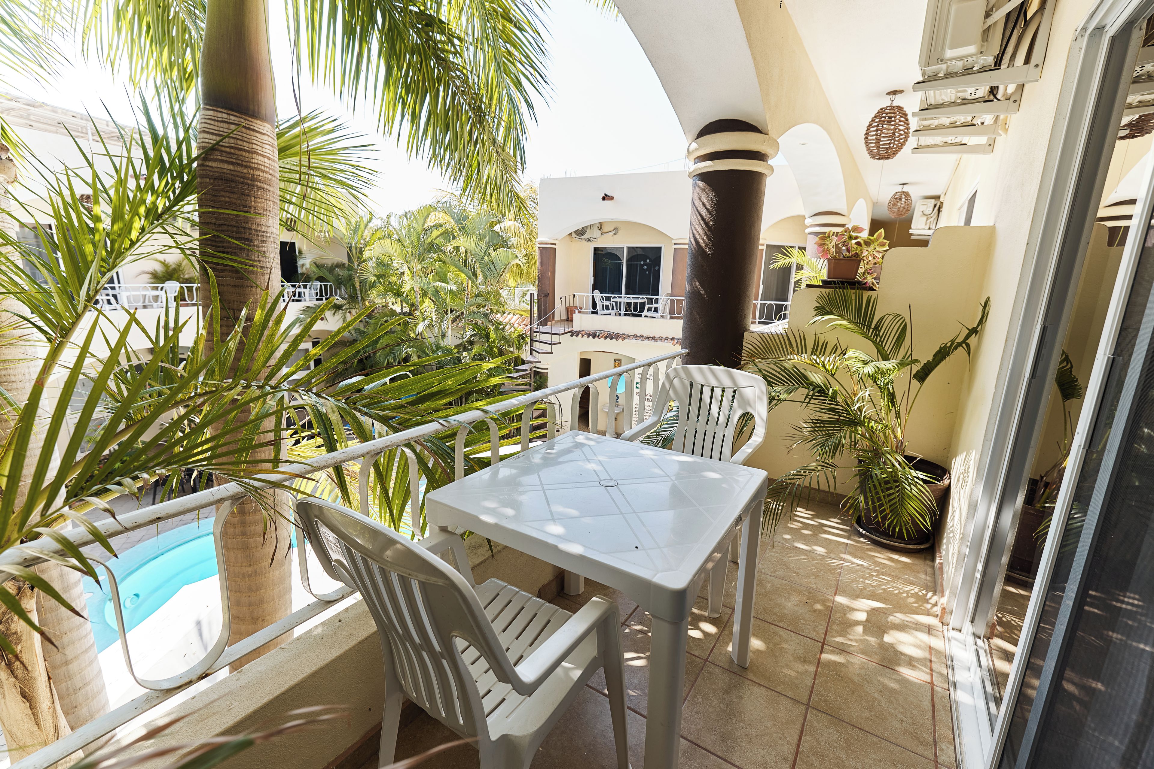 Standard Quadruple Room, Pool View | Outdoor dining
