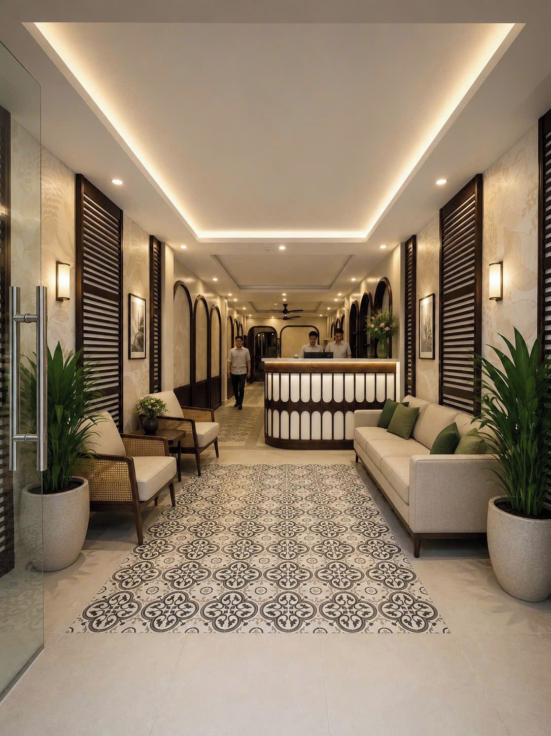 A hotel lobby with a reception desk, seating area, and a patterned floor.