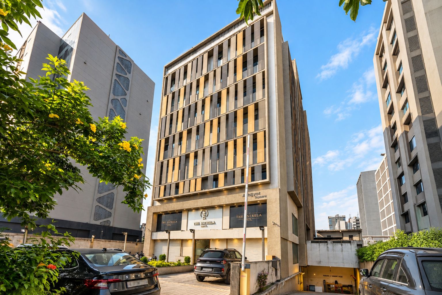 A multi-story building with a modern architectural design, featuring a mix of glass and metal facade elements.