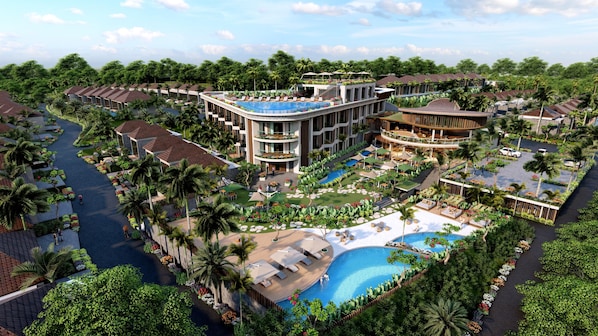 A resort with multiple buildings, a central pool, and surrounding greenery.