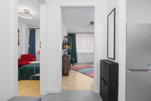 A modern apartment with a kitchenette, a dining area, and a living space. - Warsaw | Złota 11 | Comfortable Apartment | Downtown (Warszawa)