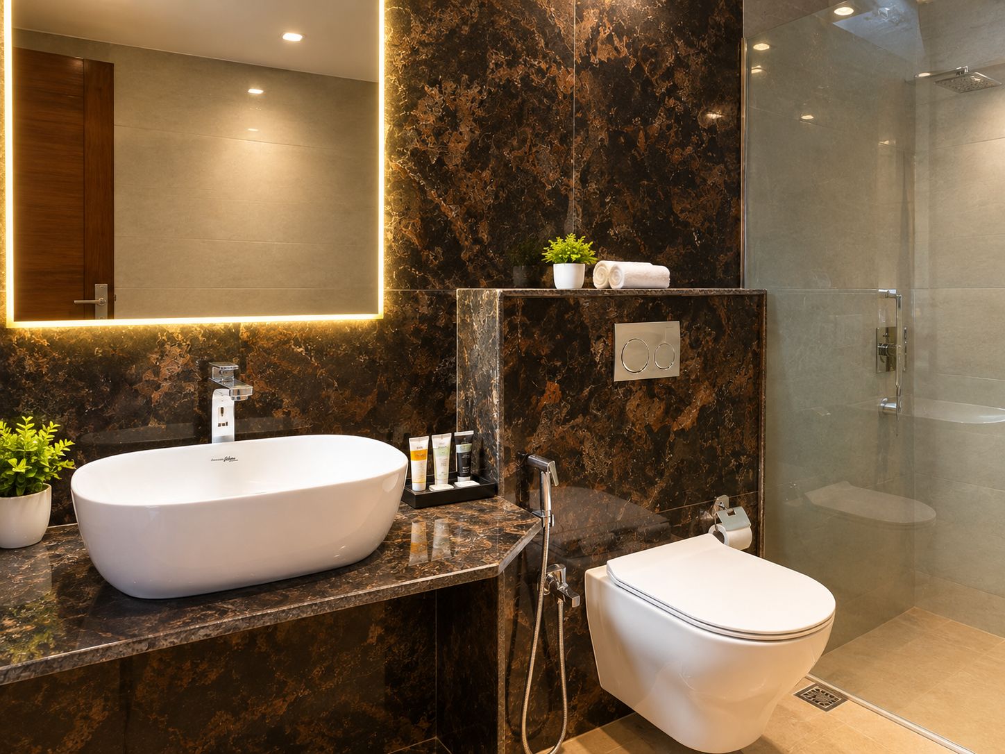 A modern bathroom with a large oval sink, a toilet, and a glass-enclosed shower.