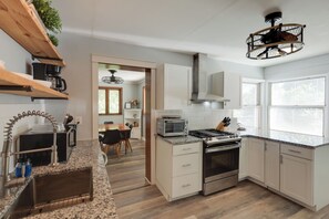 A modern kitchen with a built-in oven, a gas stove, and a coffee machine. - Centrally Located Cincinnati Escape w/ Deck & Yard (Cincinnati)