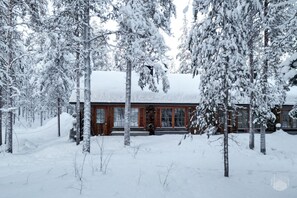A cabin surrounded by snow-covered trees. - Levi Pikkurakka 4A3 by Holiday in Lapland (Levi)