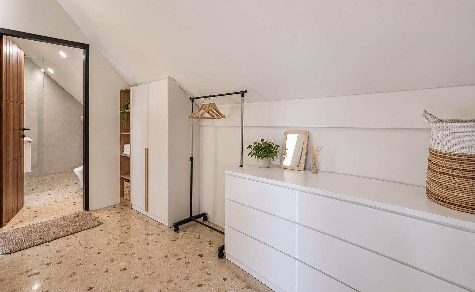 A modern bathroom with a shower, a toilet, and a vanity with a mirror.