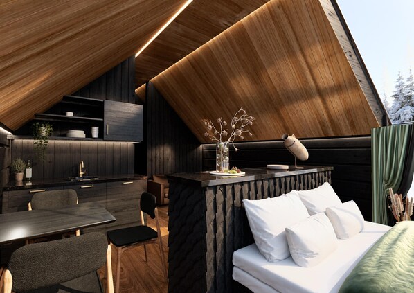A modern interior with a dining area, kitchen, and sleeping space.