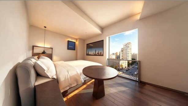 A modern hotel room with a bed, a sofa, a round table, and a city view through a large window. - Ruilan (Guangzhou)
