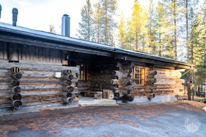 A log cabin with a chimney, a porch, and a door labeled 'A'.