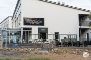 A building with a sign for 'BeachRose Cafe & Bar'.