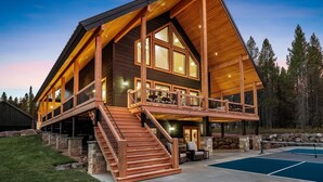 A large, multi-level wooden cabin with a prominent staircase, a pool, and a deck area. - Emerald Pines Lodge+HotTub+Cent AC+20mYellowstone (Island Park)