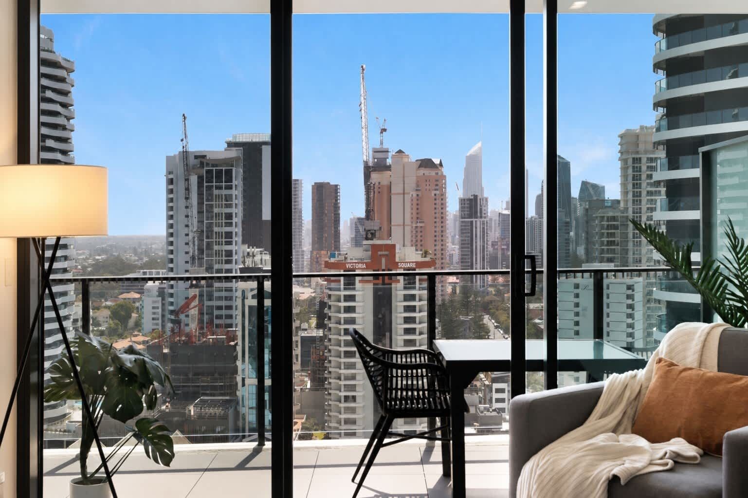 Enjoy dramatic high-rise city vistas from the cozy indoor seating area overlooking the private balcony