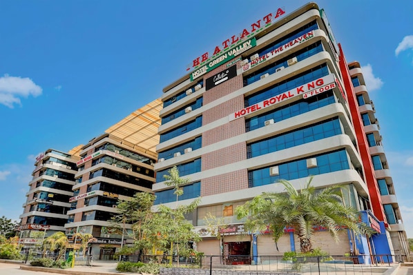 A multi-story hotel with various brands including ATLANTA, GREEN VALLEY, and ROYAL KNG. - Collection Ransan Circle Nana Chiloda (Gandhinagar)
