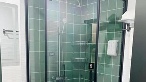 A glass-enclosed shower area with a control panel, a towel dispenser, and a hand dryer. - Greentree Inn Express Xuzhou Pizhou Tiefu Town Bus Station (Xuzhou)