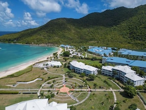 A resort with beachfront accommodations, a central circular plaza, and lush greenery. - Anse Marcel Beach Resort (Anse Marcel)