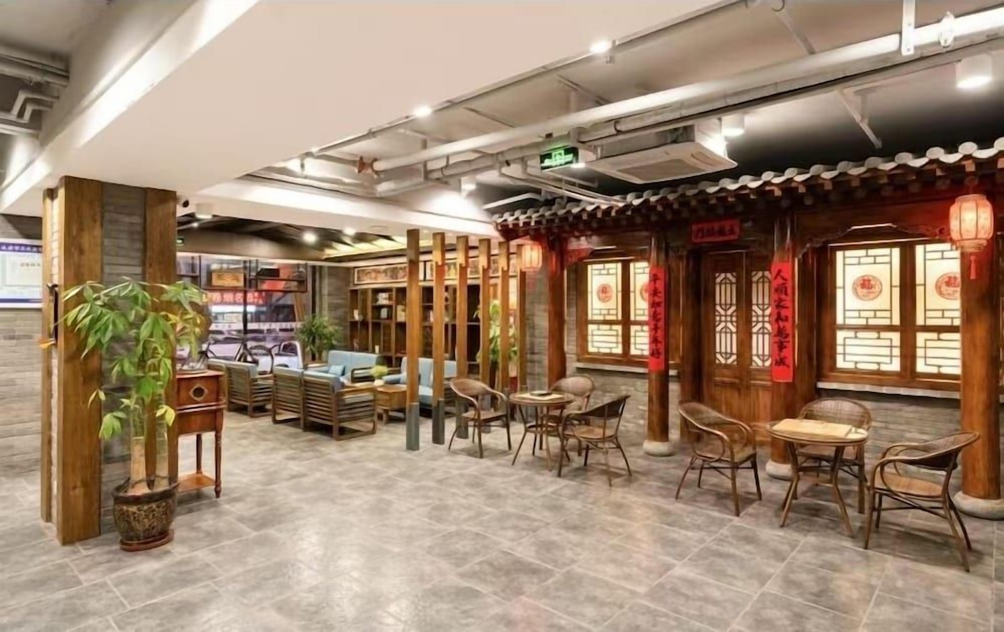 A traditional-style interior with wooden furniture, tiled flooring, and decorative lanterns.